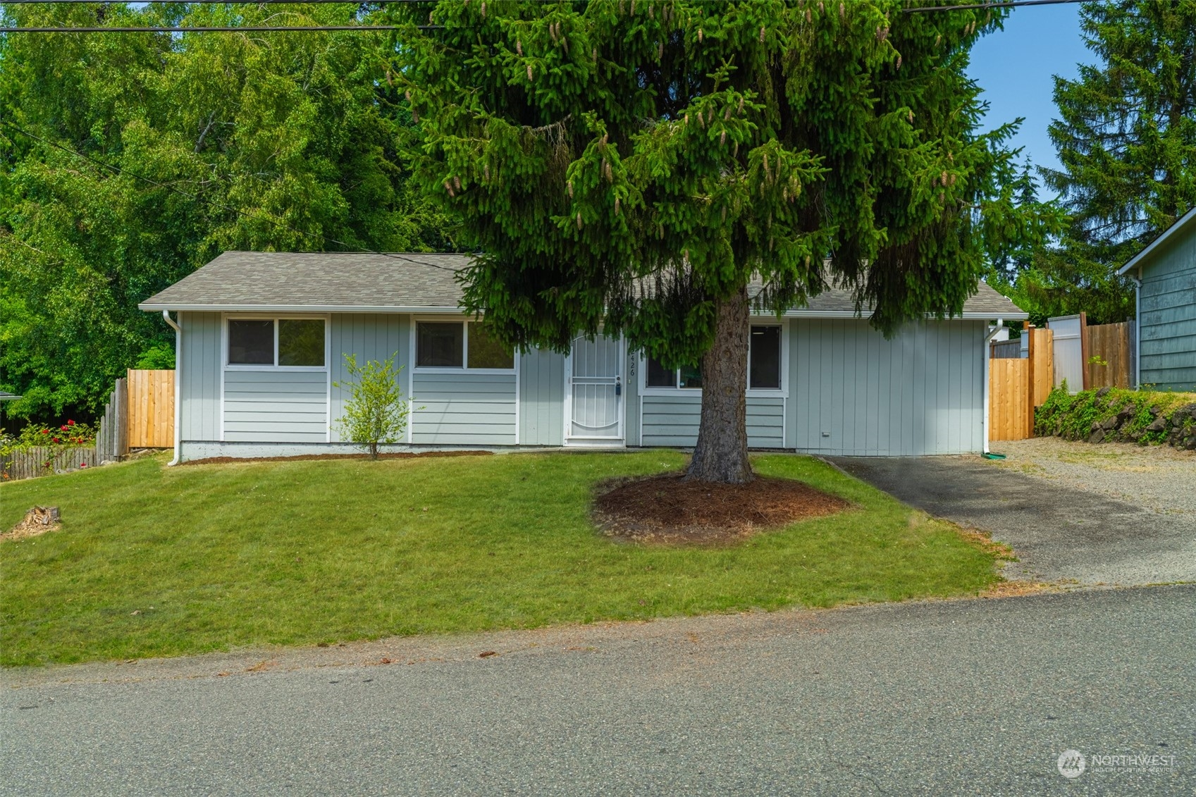 2426 Southwest 328th Street Federal Way, WA 98023 - Photo 3 of 39 a front view of a house with a yard