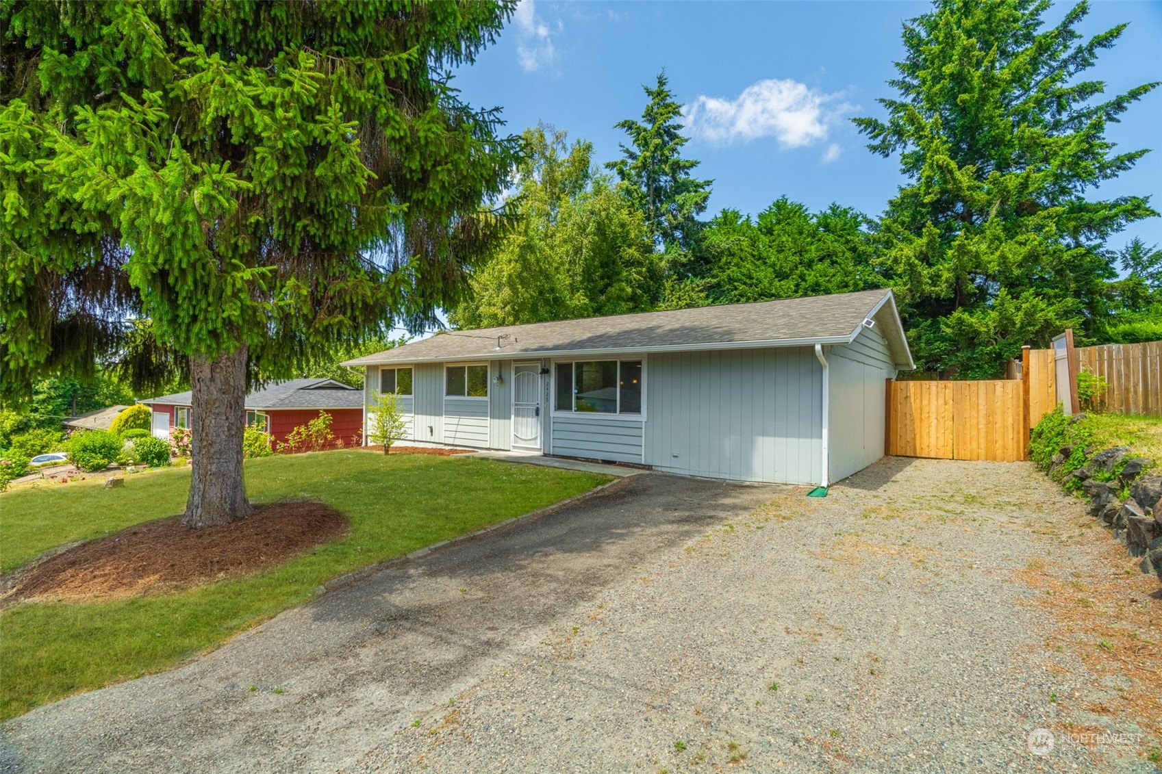 2426 Southwest 328th Street Federal Way, WA 98023 - Photo 4 of 39 front view of a house with a yard
