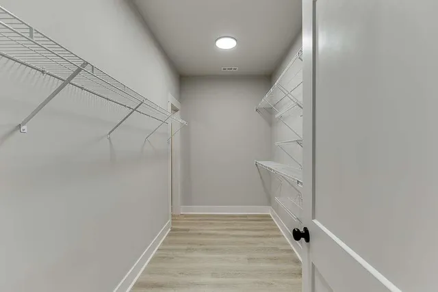 a view of an empty walk in closet
