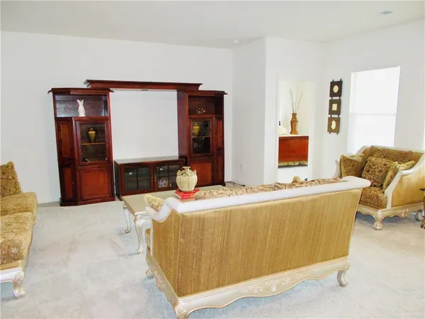 a living room with furniture and window