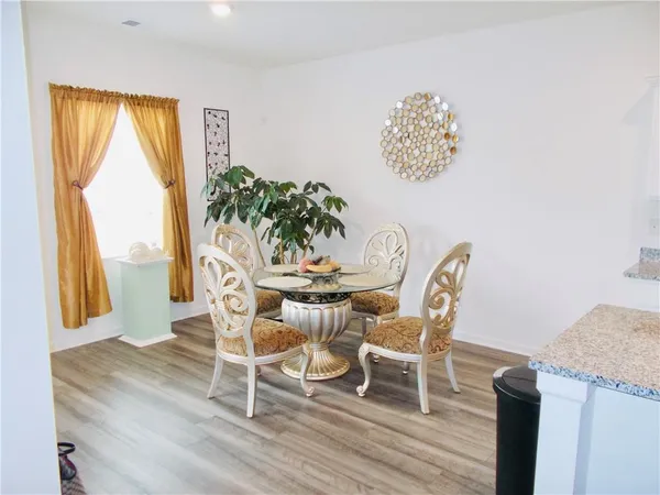 a dining room with furniture and window