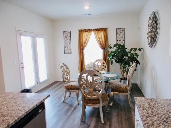 a view of a livingroom with furniture and window