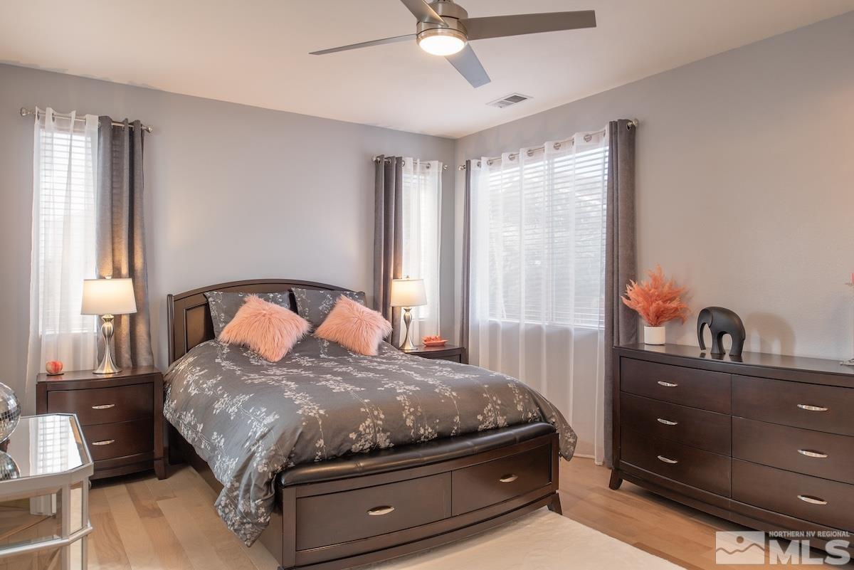 10417 Chadwell Drive Reno, NV 89521 - Photo 12 of 40 a bedroom with a bed and window