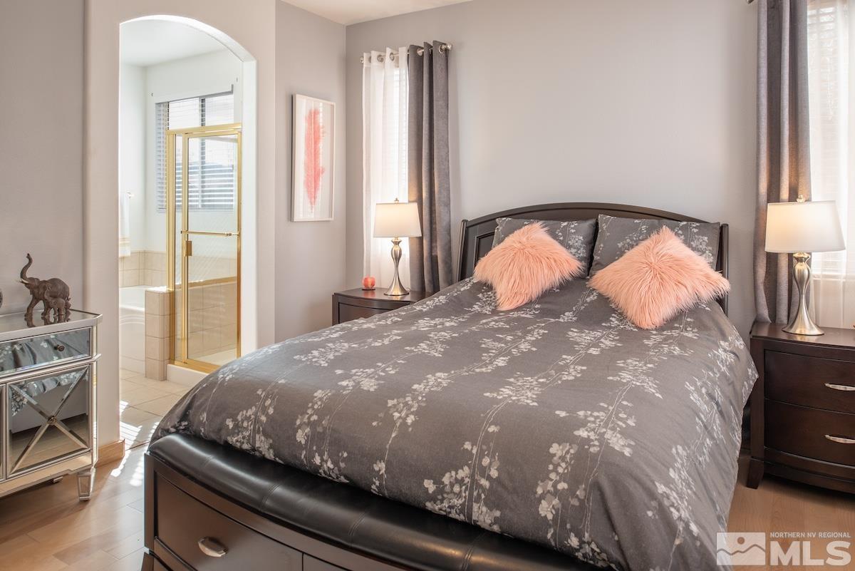 10417 Chadwell Drive Reno, NV 89521 - Photo 13 of 40 a bedroom with a bed and window