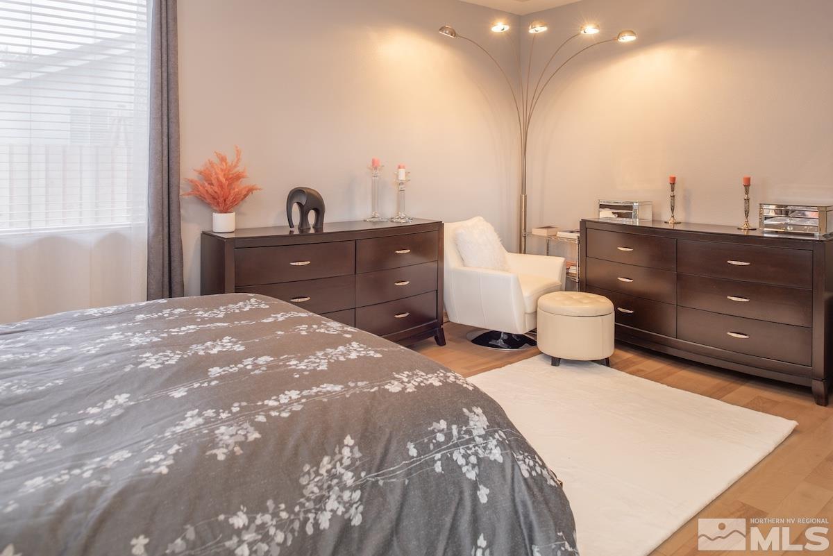 10417 Chadwell Drive Reno, NV 89521 - Photo 14 of 40 a bedroom with a bed and a night stand