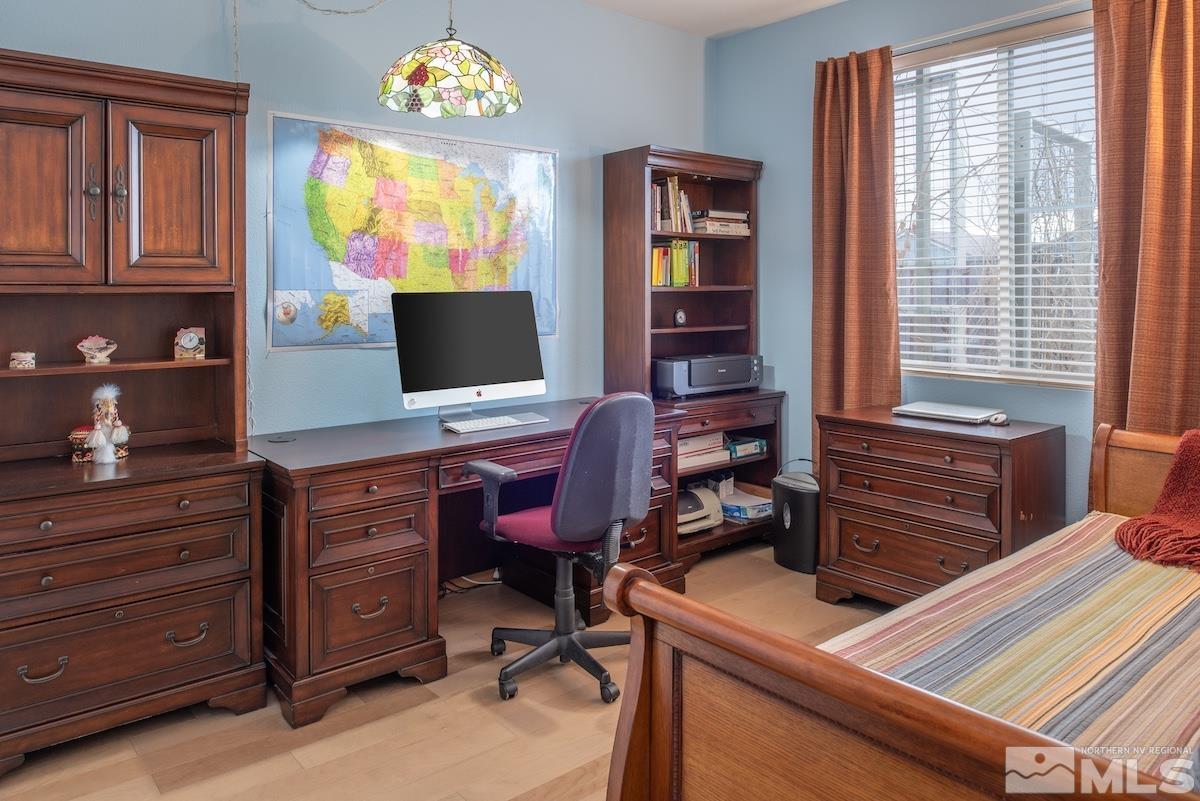 10417 Chadwell Drive Reno, NV 89521 - Photo 18 of 40 a view of a workspace with furniture and a window