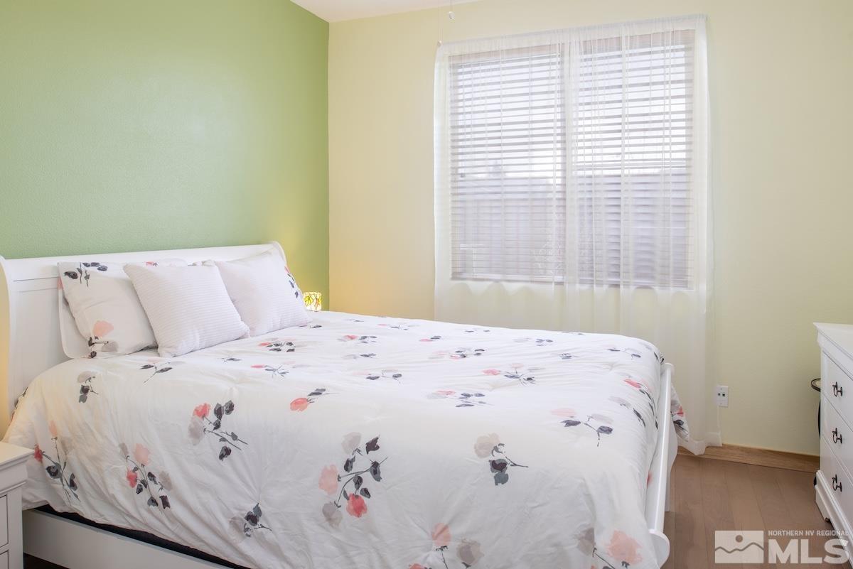 10417 Chadwell Drive Reno, NV 89521 - Photo 19 of 40 a bedroom with a bed and a window
