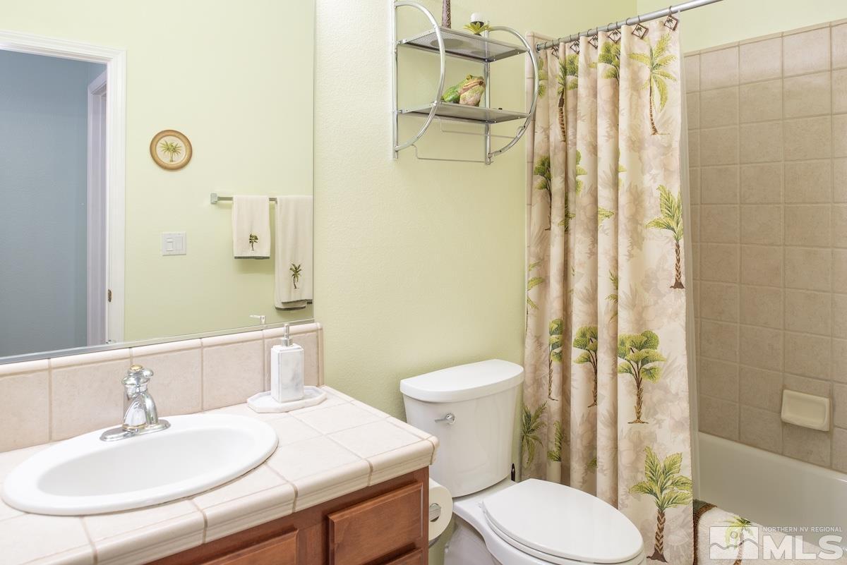 10417 Chadwell Drive Reno, NV 89521 - Photo 20 of 40 a bathroom with a sink and toilet