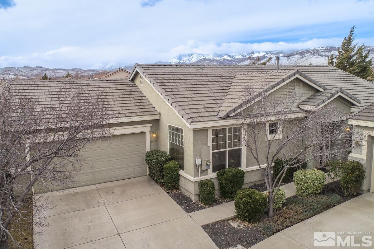 10417 Chadwell Drive Reno, NV 89521 - Photo 2 of 40 a front view of a house with a garden