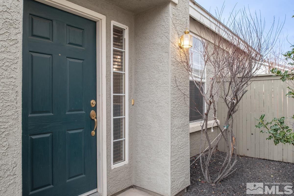 10417 Chadwell Drive Reno, NV 89521 - Photo 22 of 40 front view of a house with a door and wooden door
