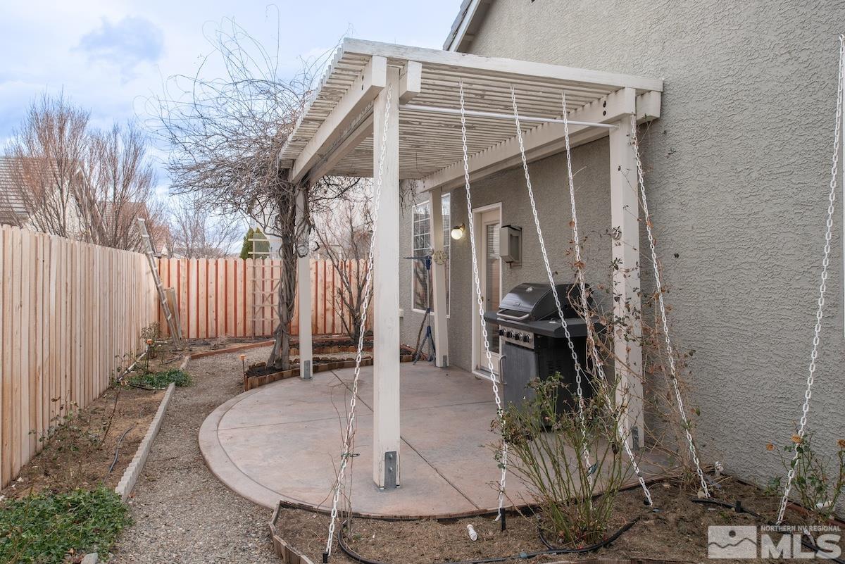 10417 Chadwell Drive Reno, NV 89521 - Photo 25 of 40 a backyard of a house with table and chairs