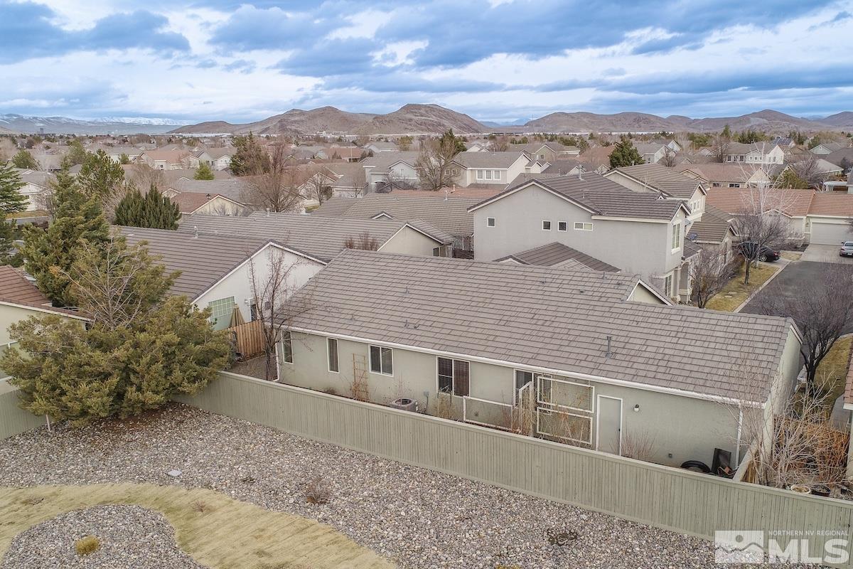 10417 Chadwell Drive Reno, NV 89521 - Photo 33 of 40 a view of a big house with a mountain in the background