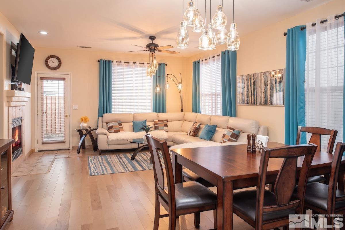 10417 Chadwell Drive Reno, NV 89521 - Photo 8 of 40 a view of a dining room with furniture window and wooden floor