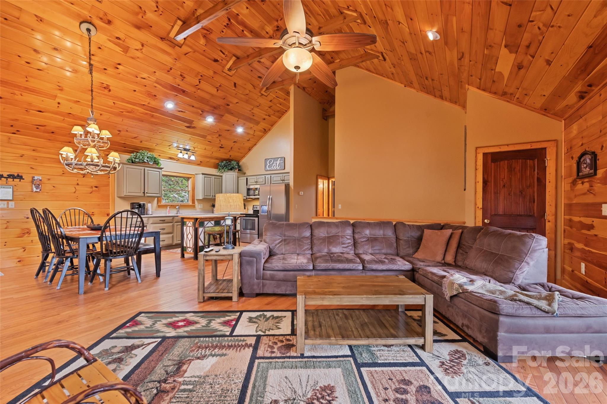 235 Soaring Eagle Road Bryson City, NC 28713 - Photo 11 of 42 a outdoor space with lots of white furniture and a rug