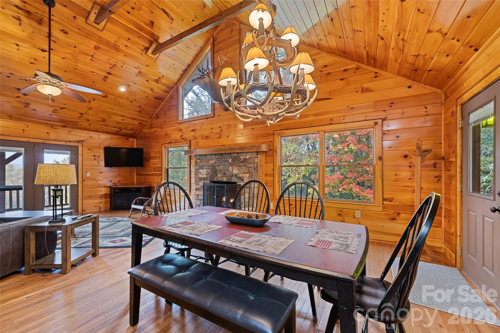 235 Soaring Eagle Road Bryson City, NC 28713 - Photo 11 of 43 a view of a dining room with furniture wooden floor and a rug