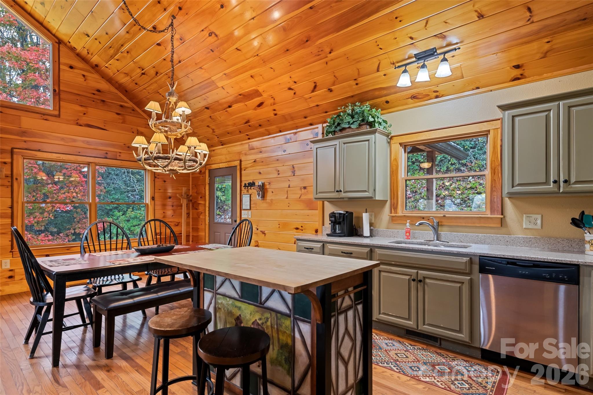 235 Soaring Eagle Road Bryson City, NC 28713 - Photo 12 of 42 a view of a dining table and chairs in the kitchen