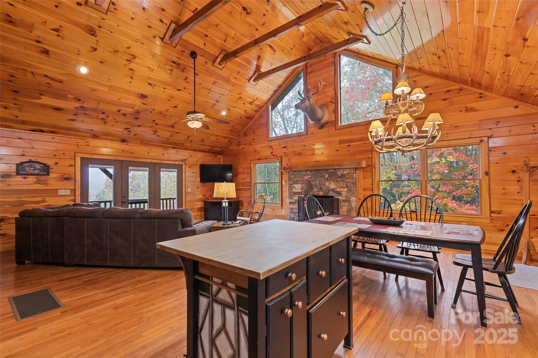 235 Soaring Eagle Road Bryson City, NC 28713 - Photo 17 of 43 a view of a dining room with furniture and wooden floor