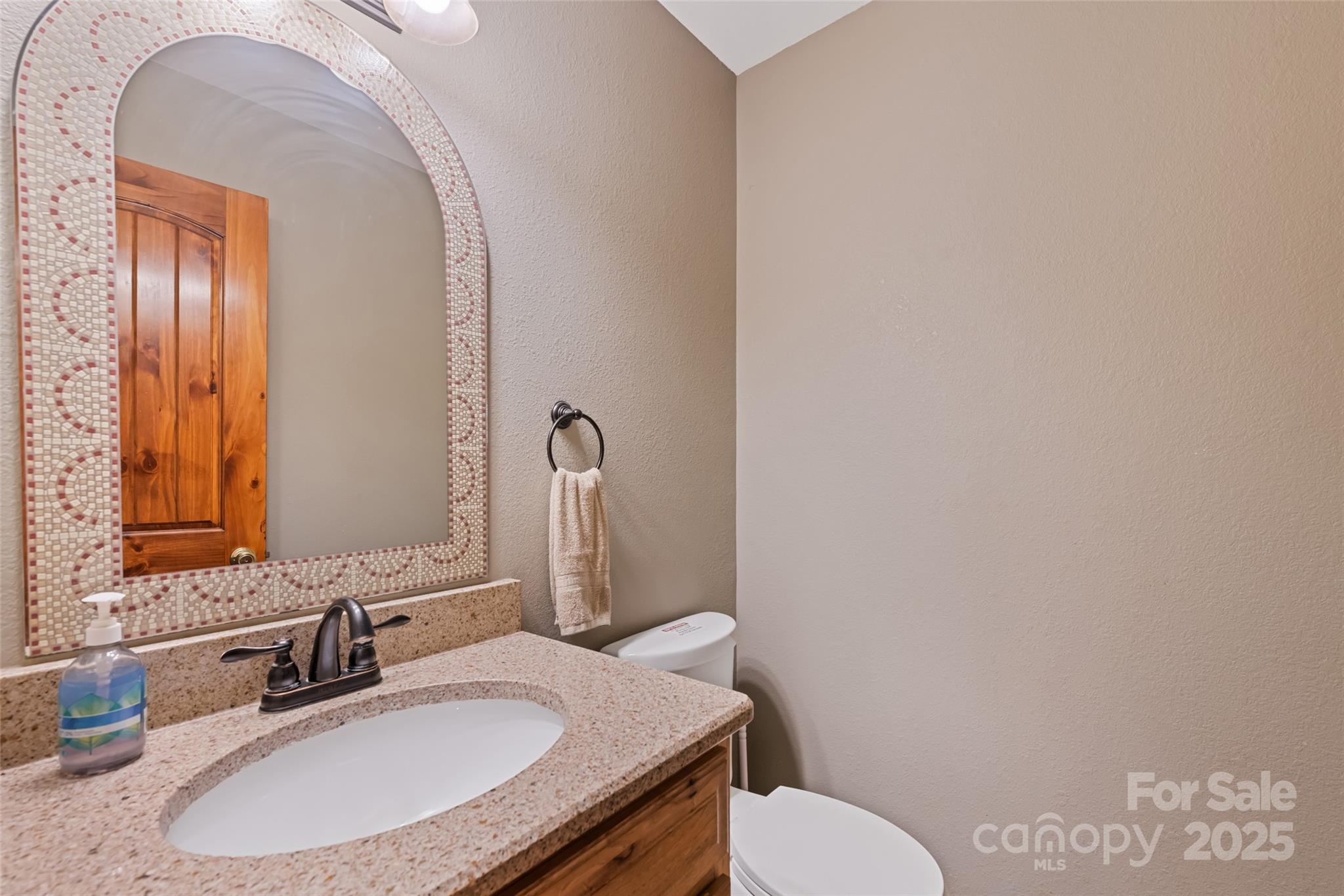 235 Soaring Eagle Road Bryson City, NC 28713 - Photo 19 of 43 a bathroom with a sink and a mirror