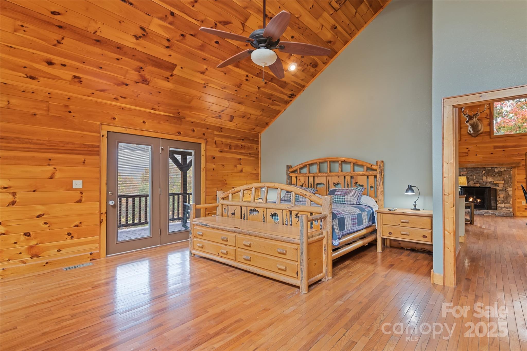 235 Soaring Eagle Road Bryson City, NC 28713 - Photo 20 of 43 a bedroom with a bed and wooden floor