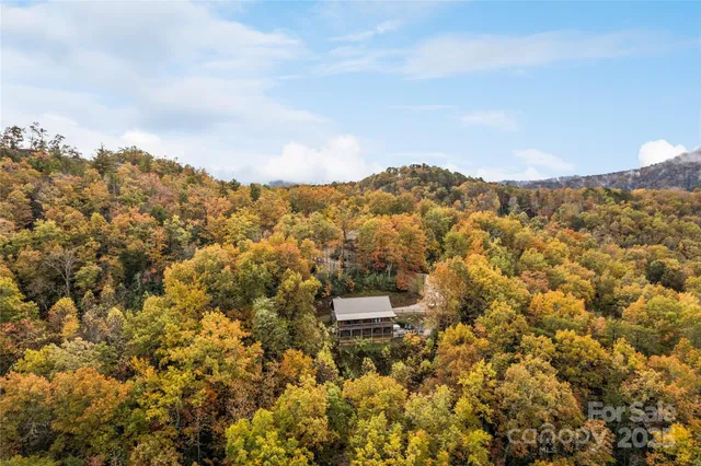 aerial view of a house with a yard