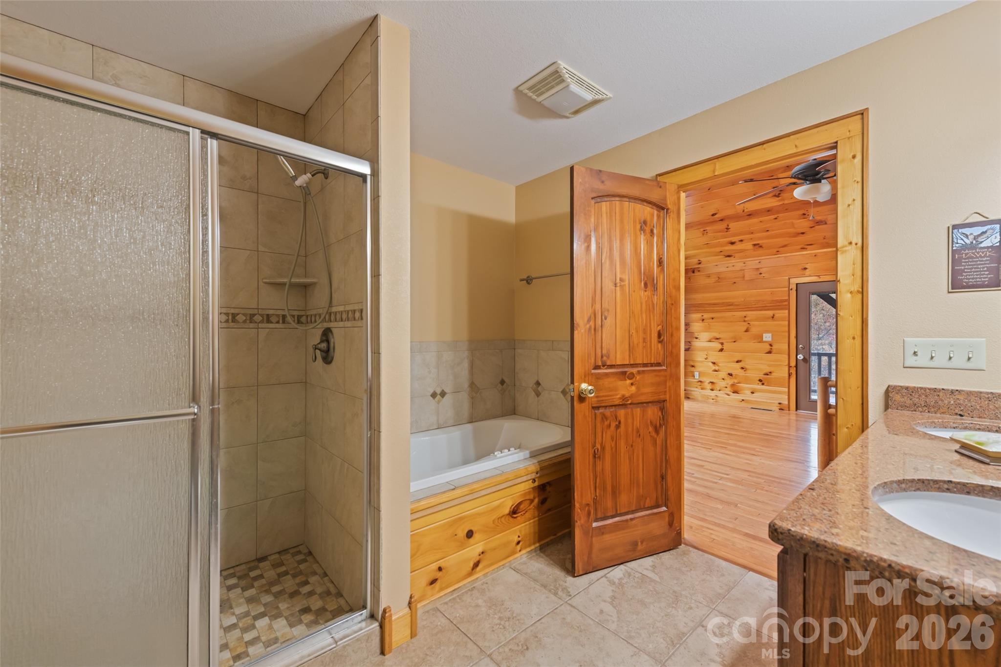 235 Soaring Eagle Road Bryson City, NC 28713 - Photo 21 of 42 a bathroom with a tub shower and sink