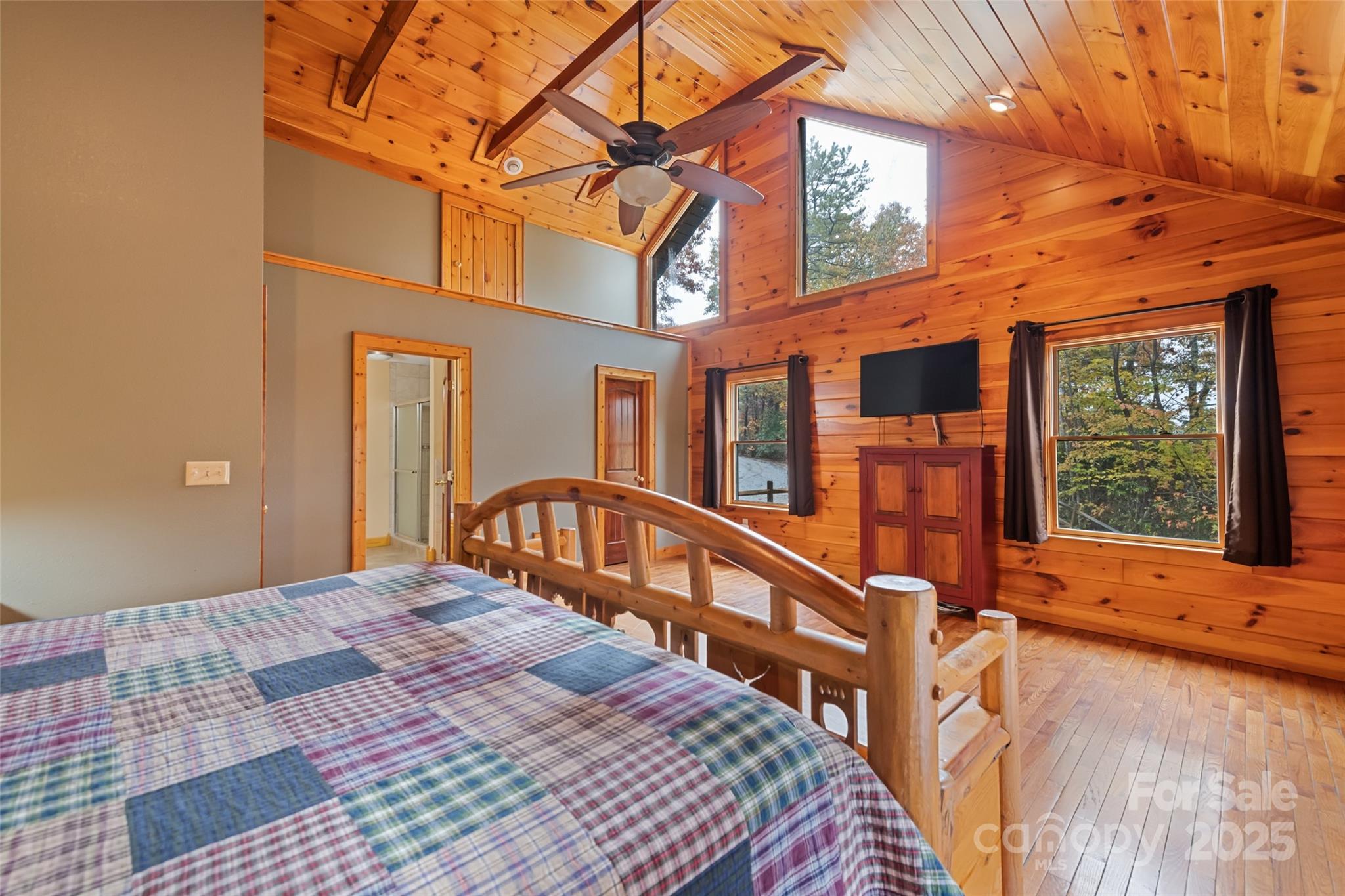 235 Soaring Eagle Road Bryson City, NC 28713 - Photo 21 of 43 a bedroom with a bed a large window with balcony view