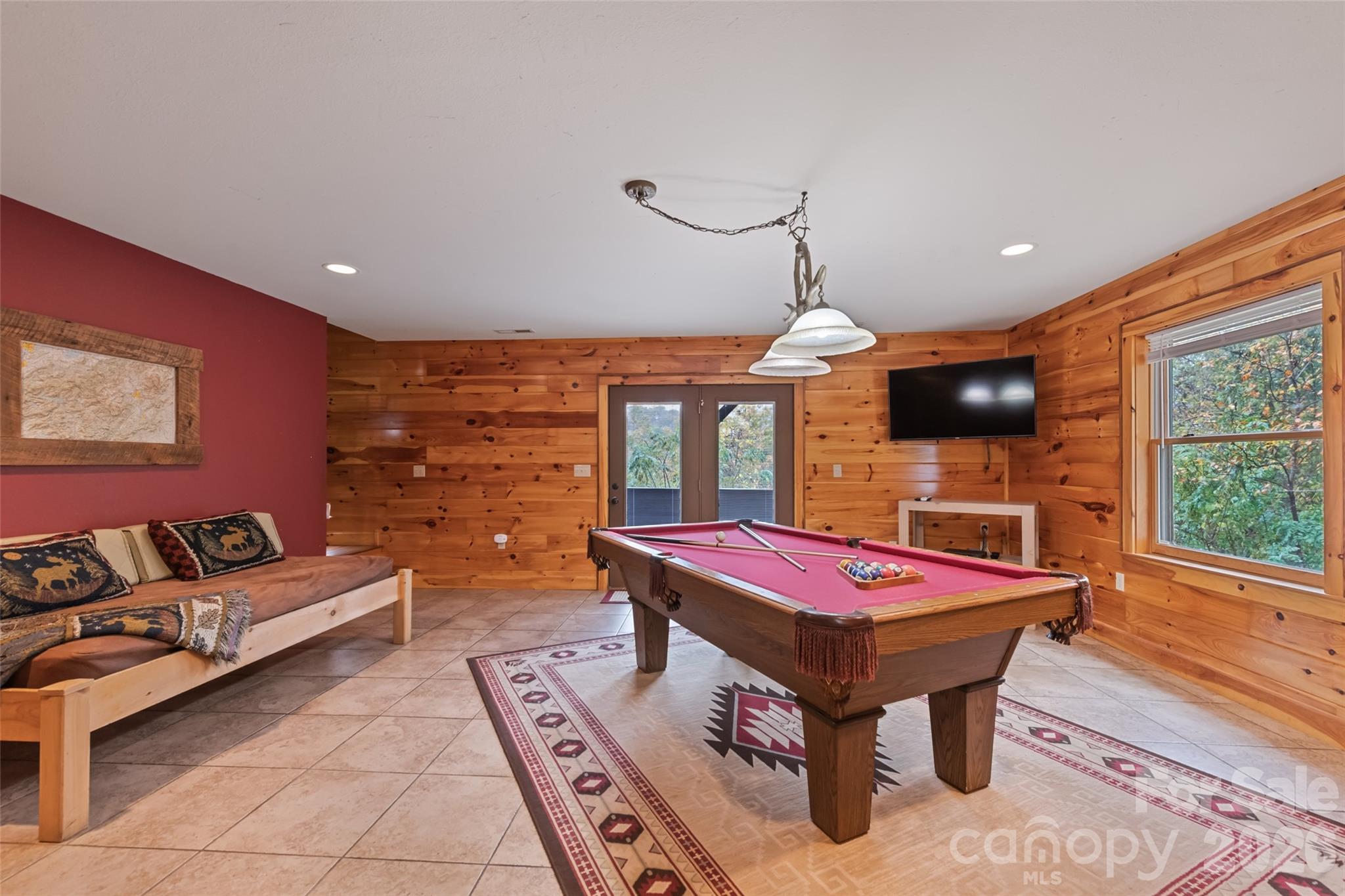 235 Soaring Eagle Road Bryson City, NC 28713 - Photo 27 of 42 a living room with furniture a flat screen tv and a pool table