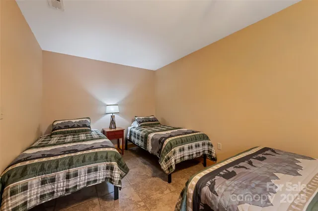 a balcony with chairs and a table