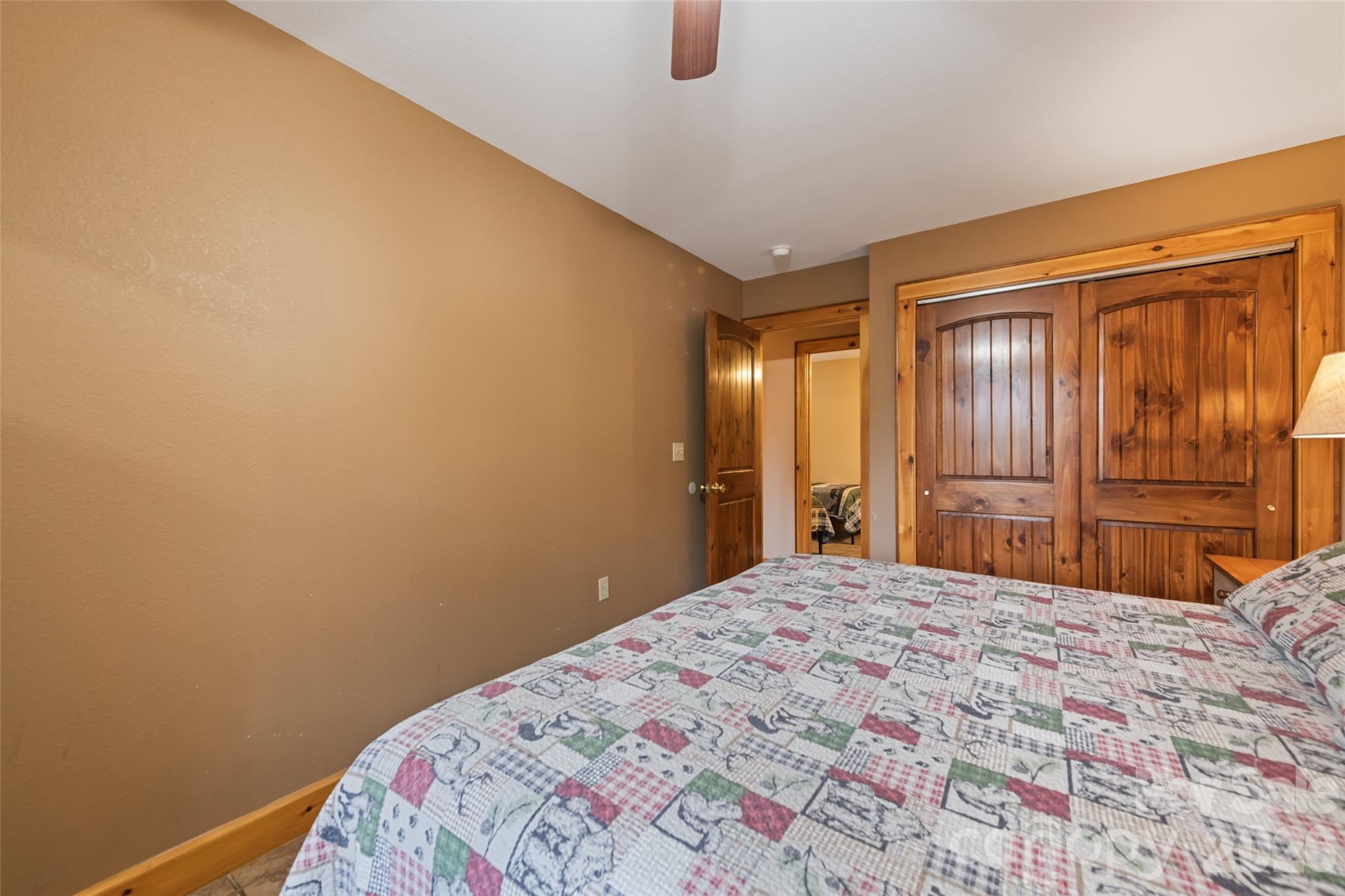 235 Soaring Eagle Road Bryson City, NC 28713 - Photo 37 of 43 a bedroom with a bed and a dresser