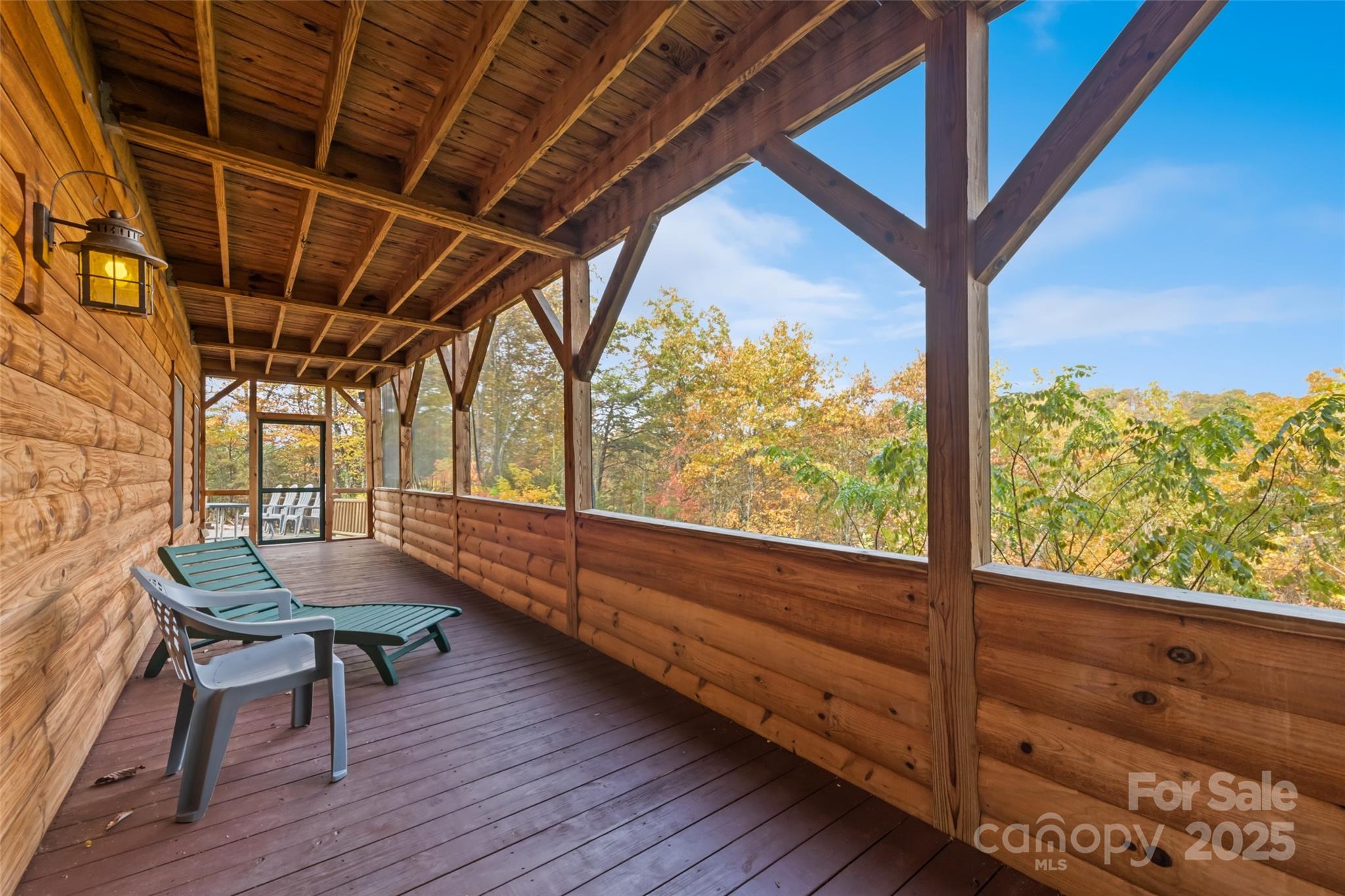 235 Soaring Eagle Road Bryson City, NC 28713 - Photo 40 of 43 a balcony with chairs and a table