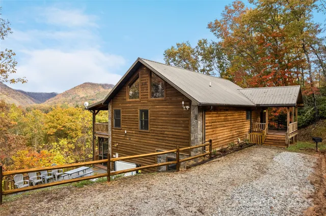a view of a house with a wooden deck