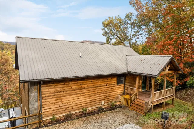 a view of a porch with wooden floor and outdoor space