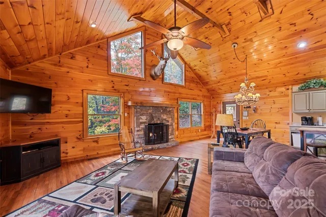 a view of a dining room with furniture wooden floor and chandelier