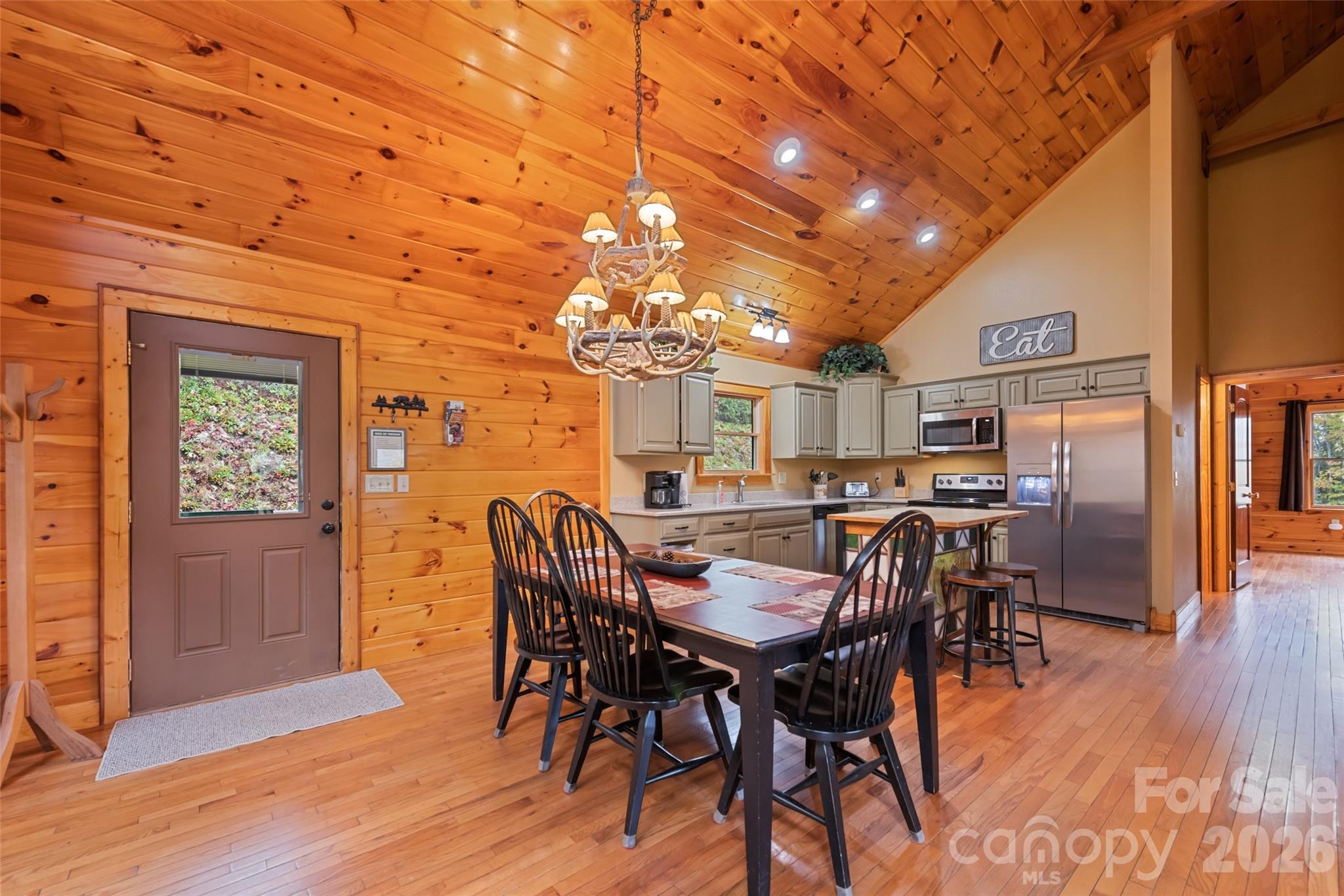 235 Soaring Eagle Road Bryson City, NC 28713 - Photo 9 of 42 a view of a dining room with furniture and wooden floor
