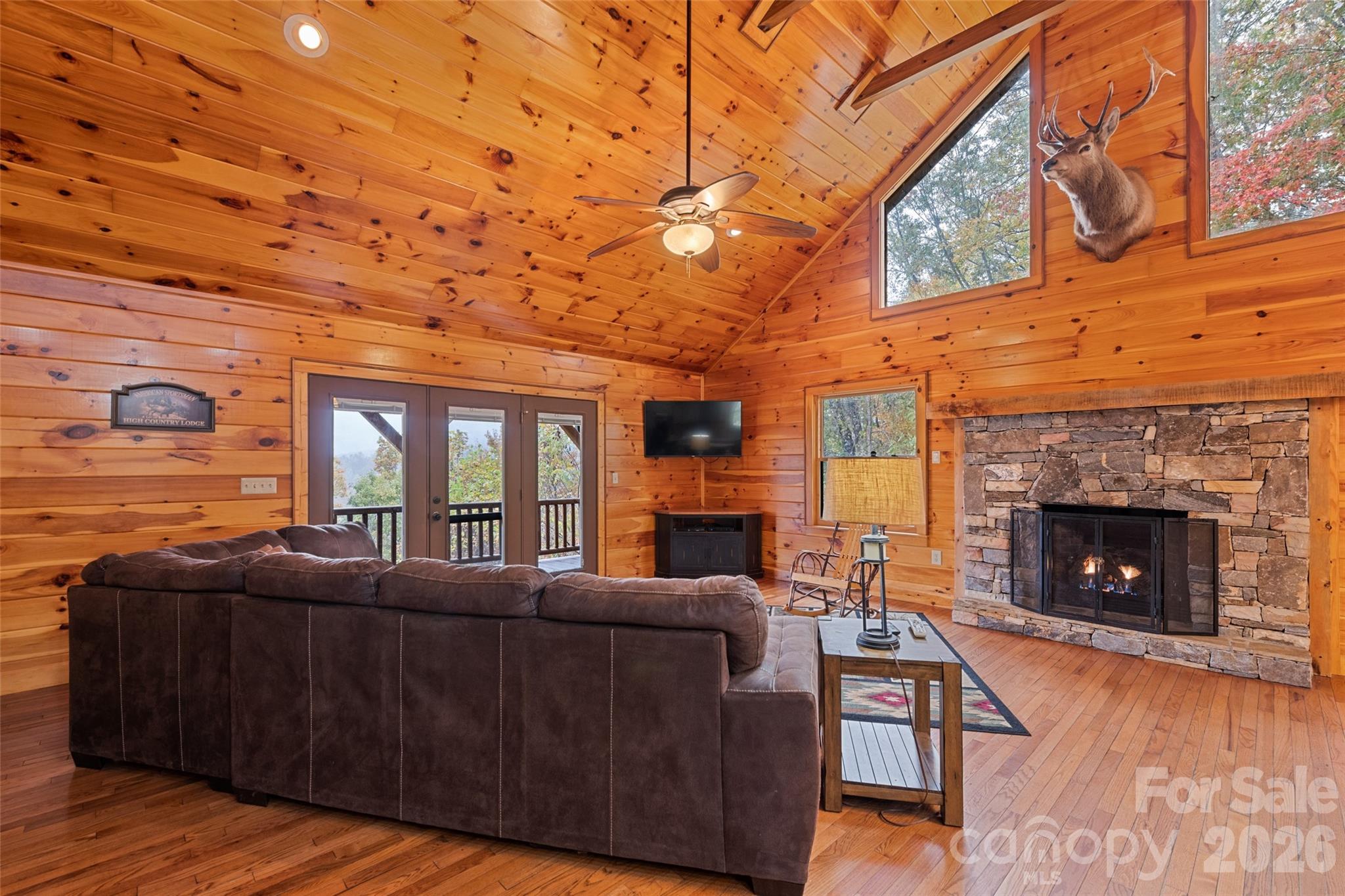 235 Soaring Eagle Road Bryson City, NC 28713 - Photo 10 of 42 a living room with furniture and a fireplace