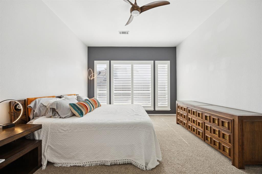 3012 Mason Avenue Corinth, TX 76210 - Photo 19 of 28 a bedroom with bed and balcony