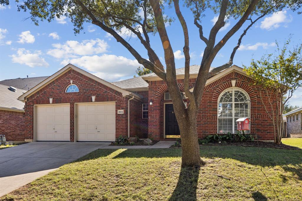 3012 Mason Avenue Corinth, TX 76210 - Photo 2 of 28 a front view of house with yard