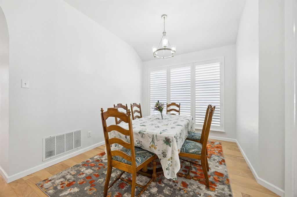 3012 Mason Avenue Corinth, TX 76210 - Photo 5 of 28 a view of a dining room with furniture and wooden floor