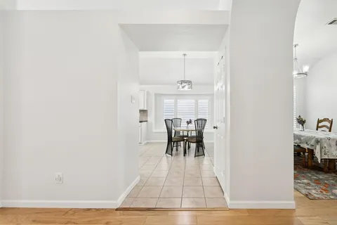 a view of dining room with table and chairs