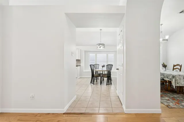 a view of dining room with table and chairs