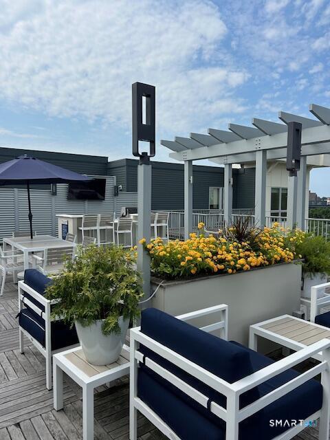 111 Morgan Street, Unit TH5 Stamford, CT 06905 - Photo 21 of 23 a front view of a house with outdoor seating