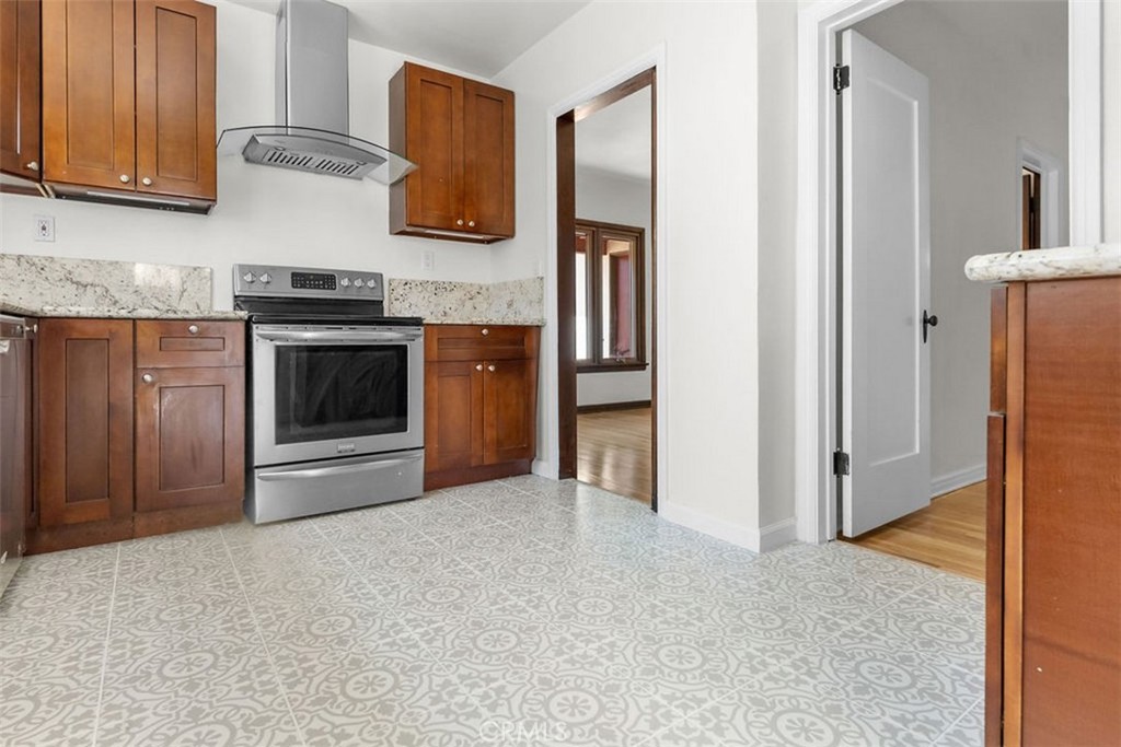 3569 Bandini Avenue Riverside, CA 92506 - Photo 12 of 51 a kitchen with stainless steel appliances granite countertop a refrigerator and a stove
