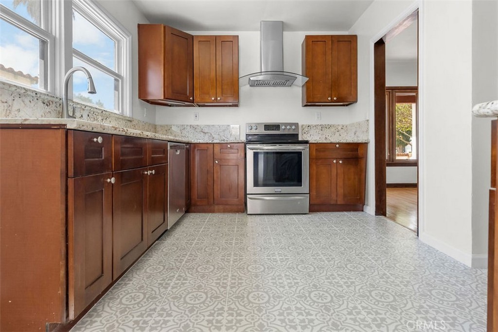 3569 Bandini Avenue Riverside, CA 92506 - Photo 13 of 51 a kitchen with stainless steel appliances granite countertop a stove and a refrigerator