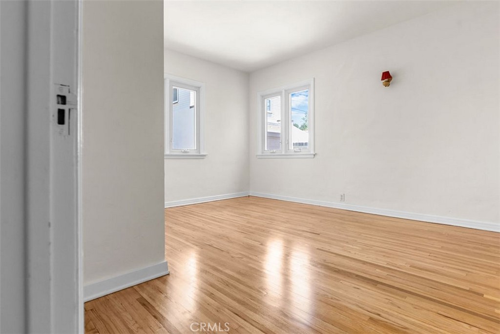 3569 Bandini Avenue Riverside, CA 92506 - Photo 20 of 51 a view of empty room with wooden floor and fan
