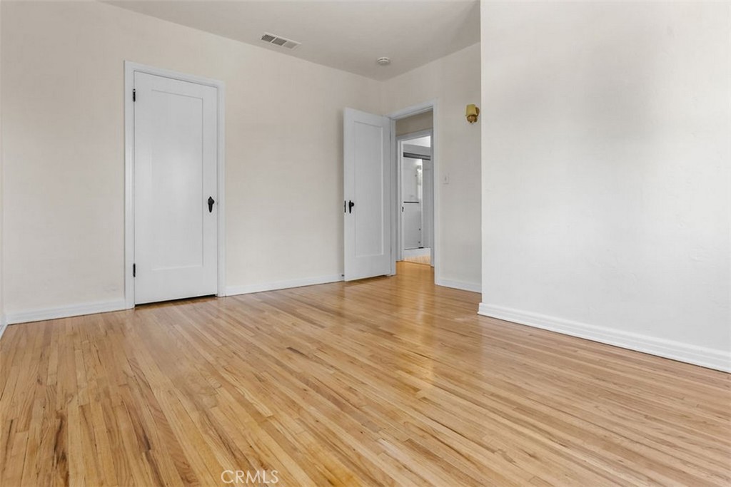 3569 Bandini Avenue Riverside, CA 92506 - Photo 22 of 51 a view of an empty room with wooden floor