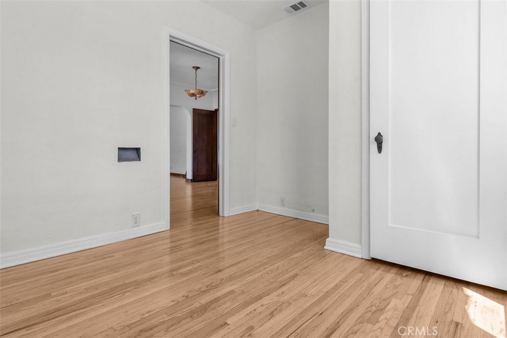 3569 Bandini Avenue Riverside, CA 92506 - Photo 24 of 51 a view of a hallway with wooden floor