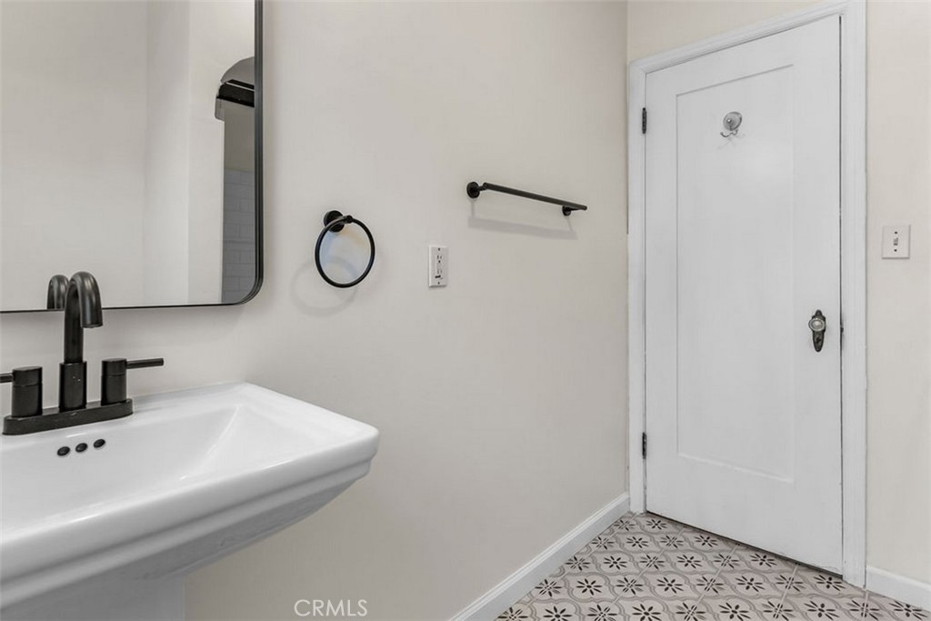 3569 Bandini Avenue Riverside, CA 92506 - Photo 26 of 51 a bathroom with a sink and a mirror