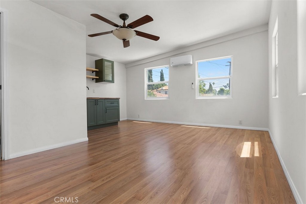 3569 Bandini Avenue Riverside, CA 92506 - Photo 31 of 51 a view of empty room with wooden floor and ceiling fan