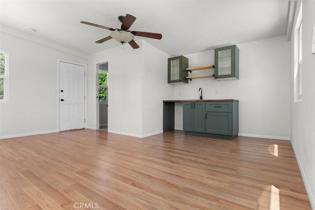 3569 Bandini Avenue Riverside, CA 92506 - Photo 32 of 51 a view of kitchen with wooden floor electronic appliances and window
