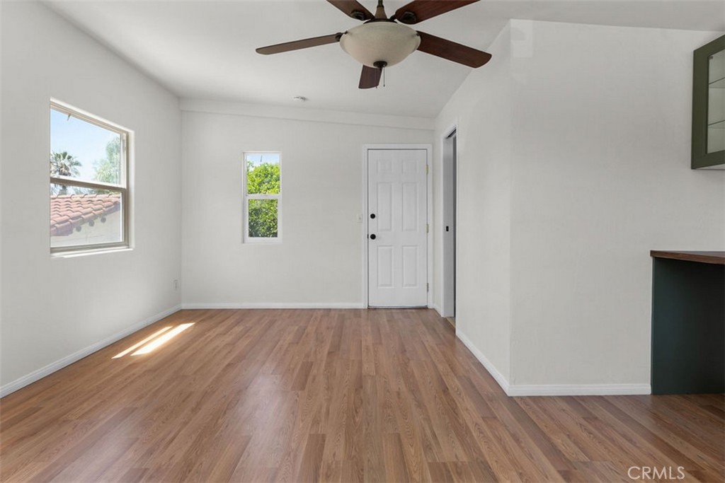 3569 Bandini Avenue Riverside, CA 92506 - Photo 33 of 51 a view of an empty room with wooden floor and a window